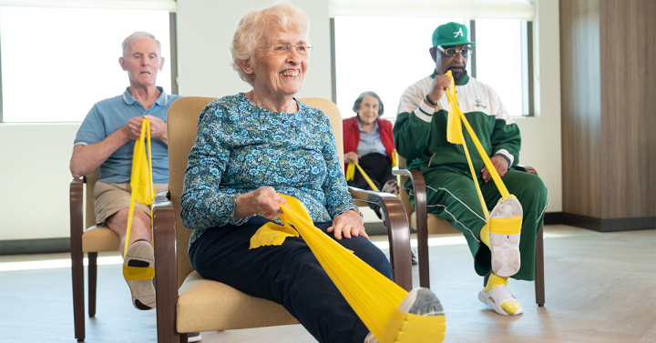 older adults exercising in chair
